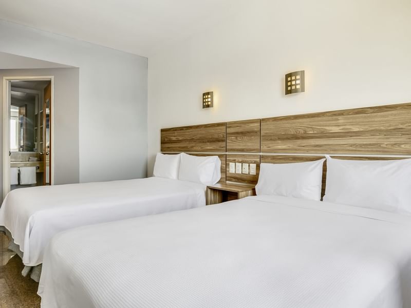 Interior view of Superior Room with two twin beds at One Hotels