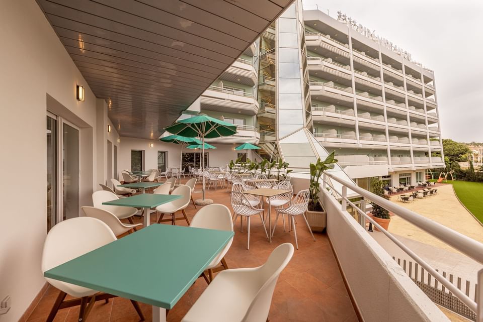 Blue and white themed terrace dining area at Hotel Piramide Salou