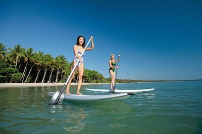 Ladies paddle boarding near Silkari Reflections Of Port Douglas