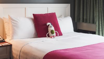 Closeup of the bed of Queen Deluxe Studio at Summit Lodge