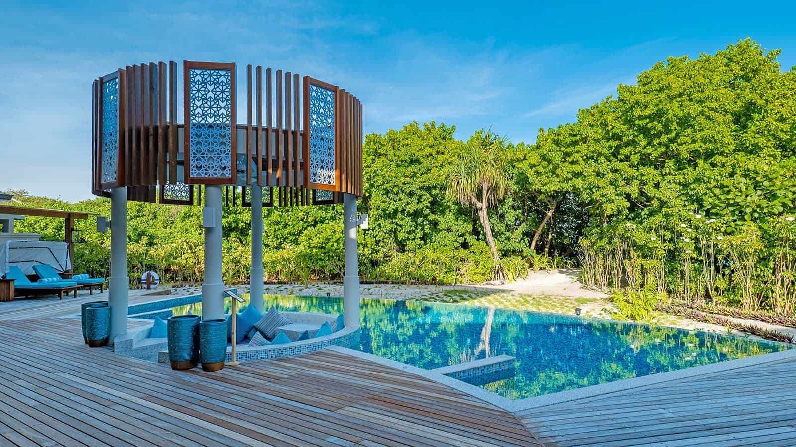 Loungers by the pool at The Signature Collection by Hideaway