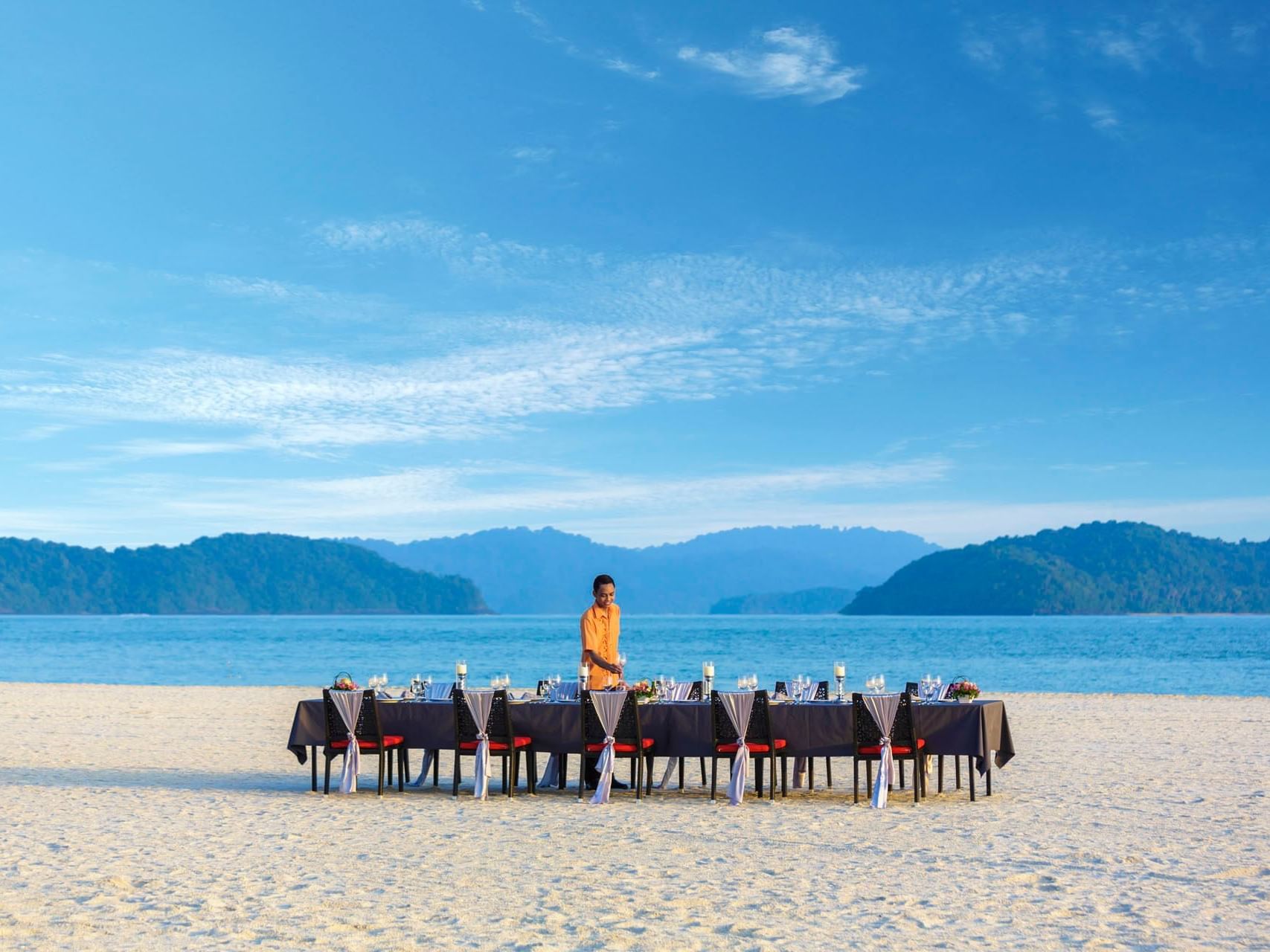Dining table set-up by the beach at Pelangi Beach Resort & Spa
