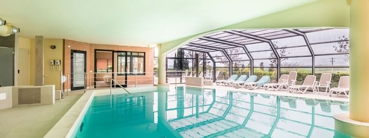 An indoor swimming pool at Precise House Montaperti Siena