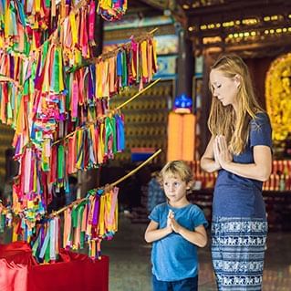 Tourists are praying in a Buddhist temple in penang