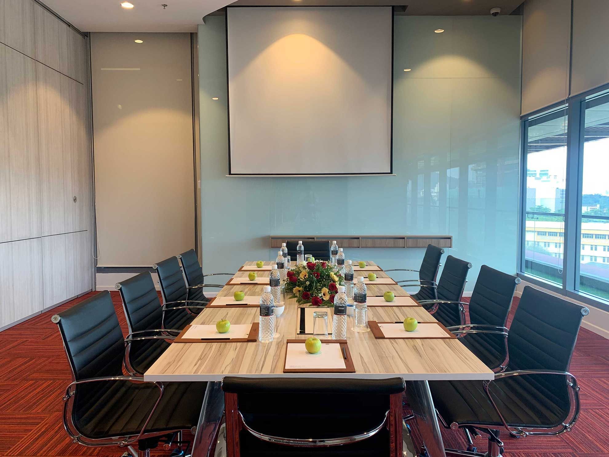 Boardroom set-up with digital screen in a meeting room at Sunway Velocity Hotel