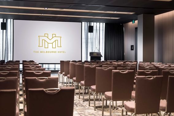 Conference set-up with a screen in Karingal Ballroom at Melbourne Hotel Perth