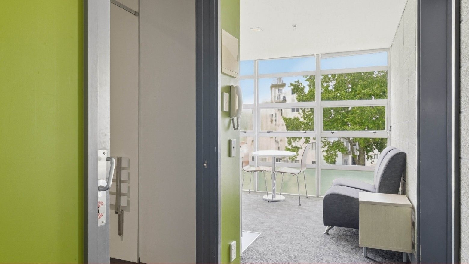 Modern room with balcony and city view at Student Living Auckland - Beach.