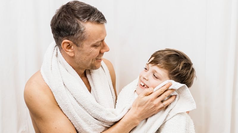 Father & son sharing a moment of warmth and comfort together at Lake Buena Vista Resort Village & Spa