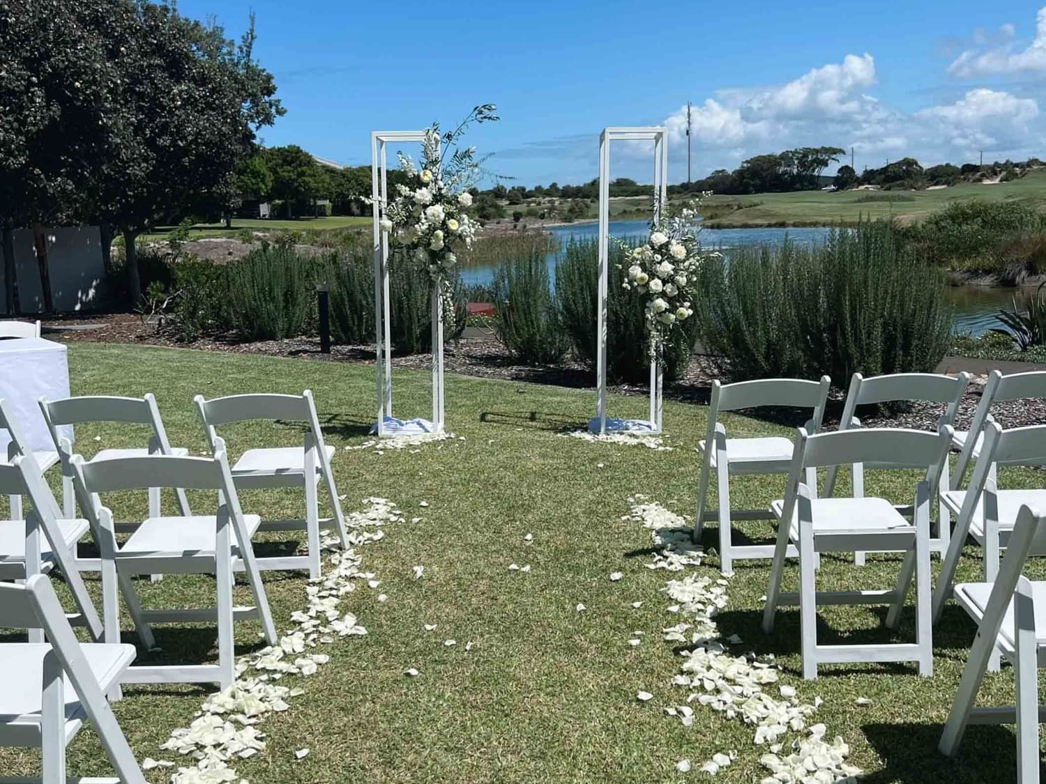 beautiful wedding ceremony set up overlooking lake