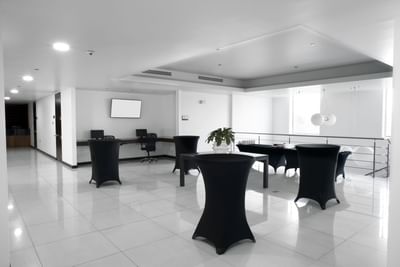 Event space in San Jose Costa Rica with cocktail tables at D Sabana Hotel