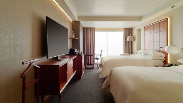 Deluxe Room with two Double Beds and a TV at Grand Fiesta Americana