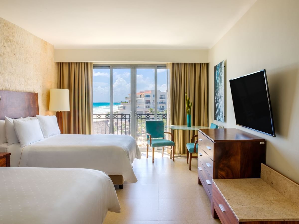 TV & sitting area by the beds in Premium Ocean View, 2 Double at Fiesta Americana