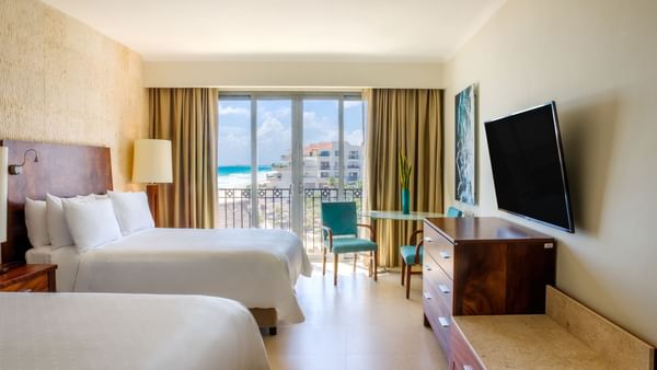 TV & sitting area by the beds in Premium Ocean View, 2 Double at Fiesta Americana