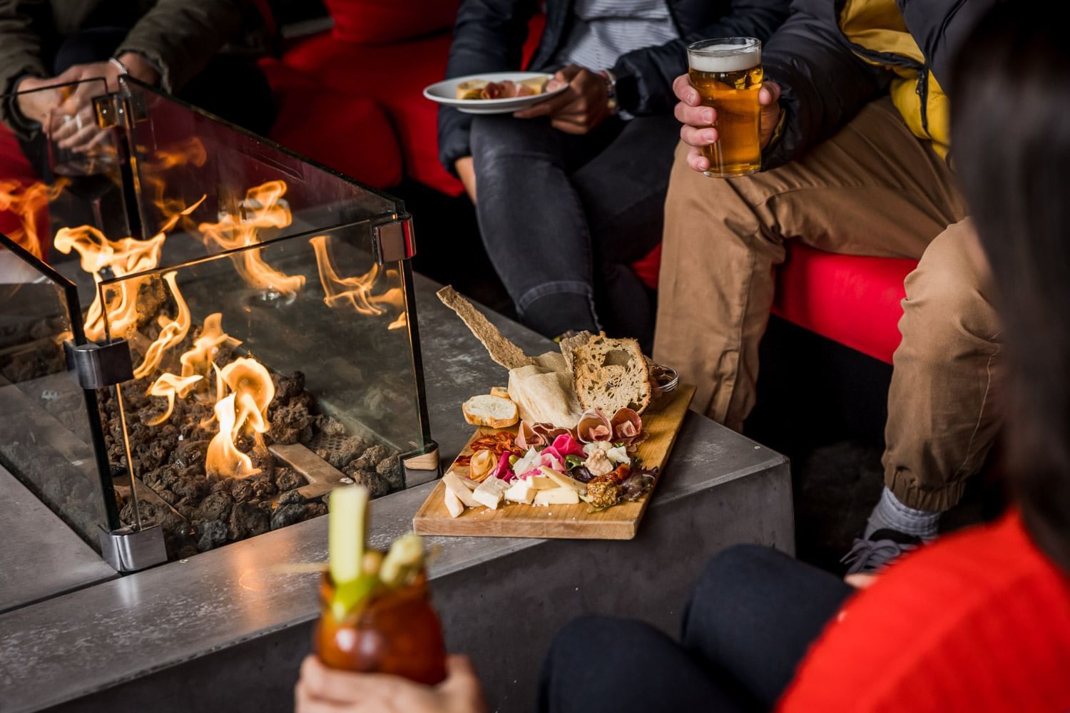 Guests having beer in Cure Lounge & Patio, Nita Lake Lodge