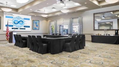 U-shape set-up in a meeting room with carpeted floors at Bilmar Beach Resort