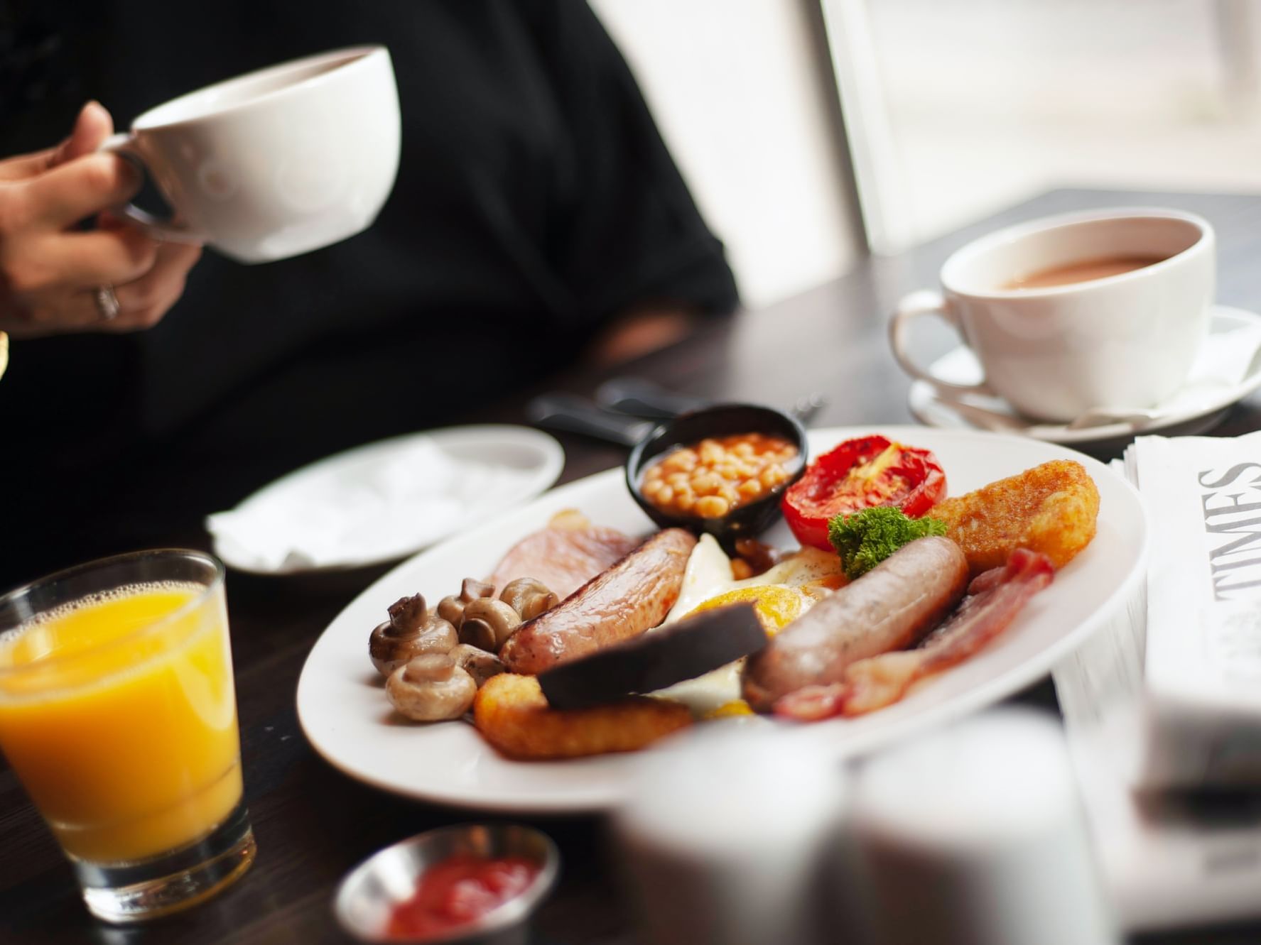 A table with food, fresh juice and tea