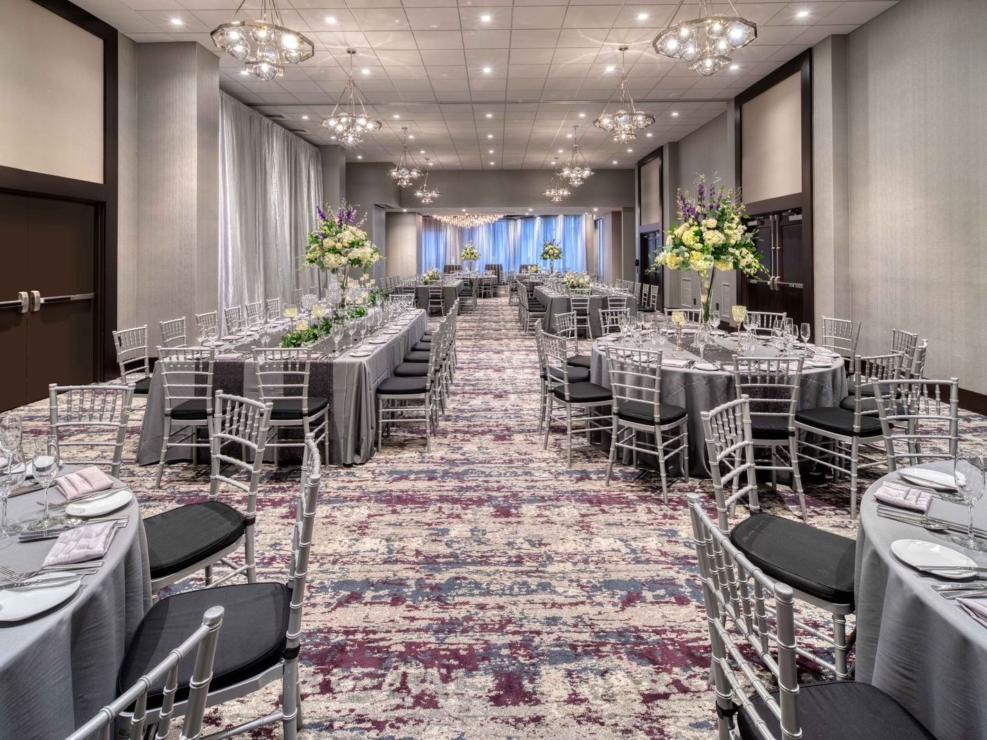 banquet room with grey linen top tables and chairs
