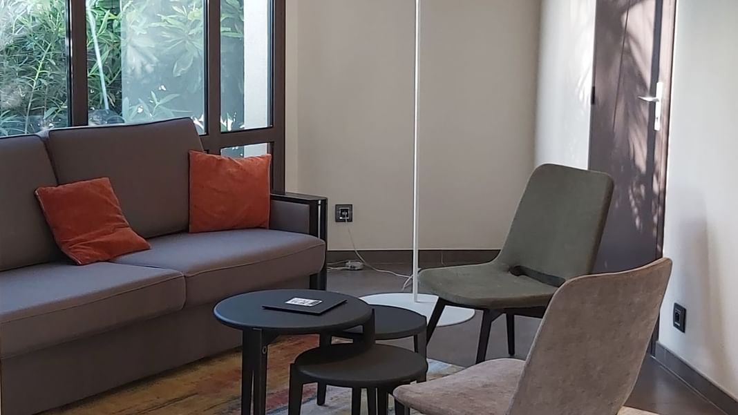Chairs, sofa & stools in lobby at Oceania Nantes Aéroport