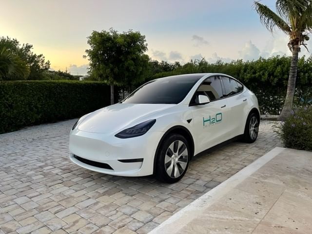 Tesla rental car parked outdoors at H2O Life Style Resort