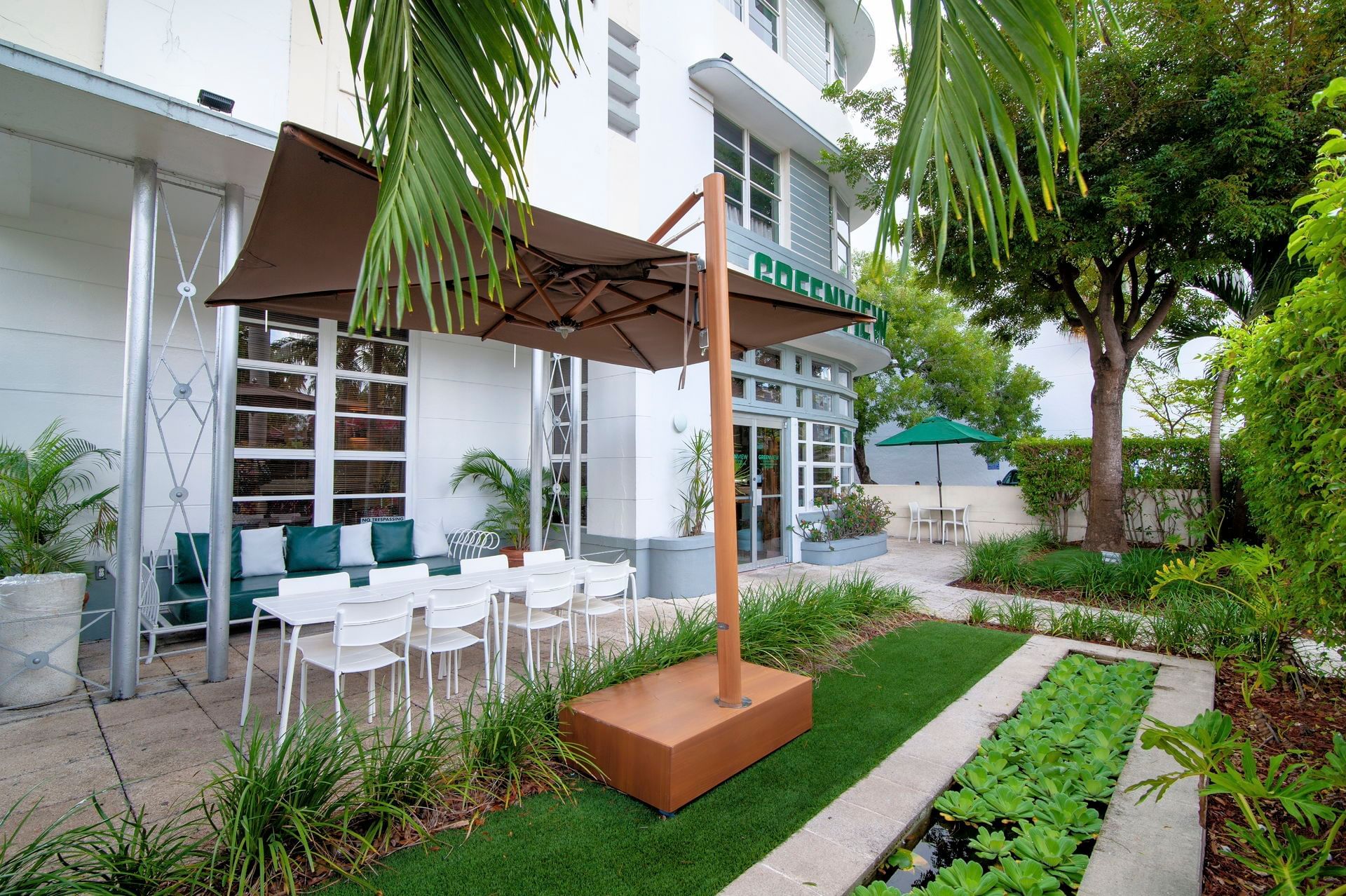 Outdoor patio with chairs at Greenview Boutique Hotel