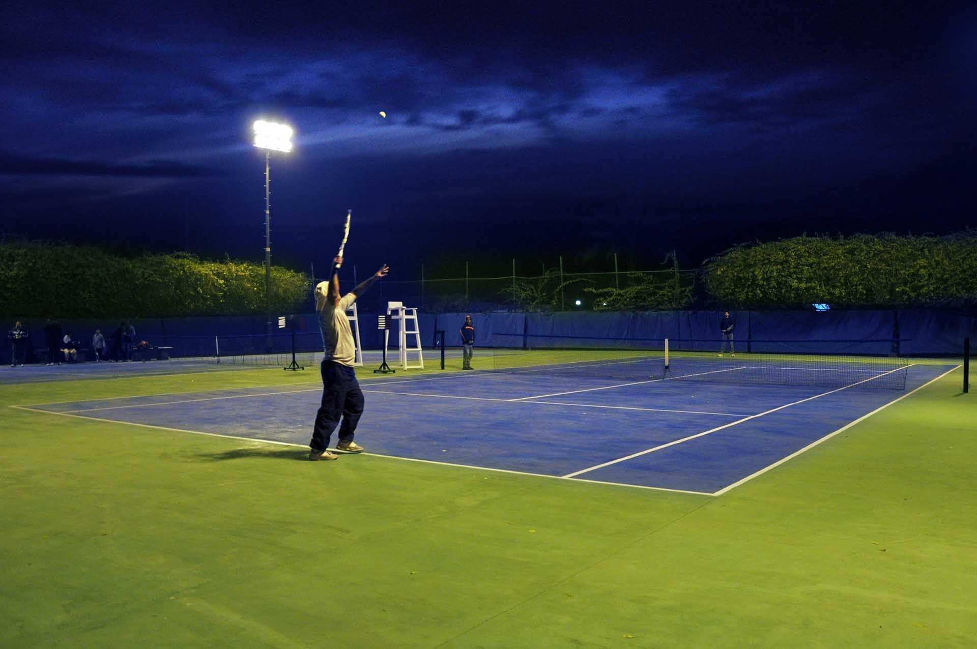A Man playing in tennis court at Faisalabad Serena Hotel