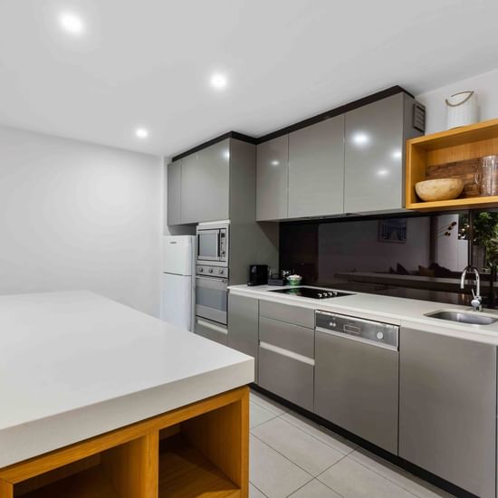 Kitchen area with counter in Deluxe Three Bedroom at Pullman Magenta Shores Resort