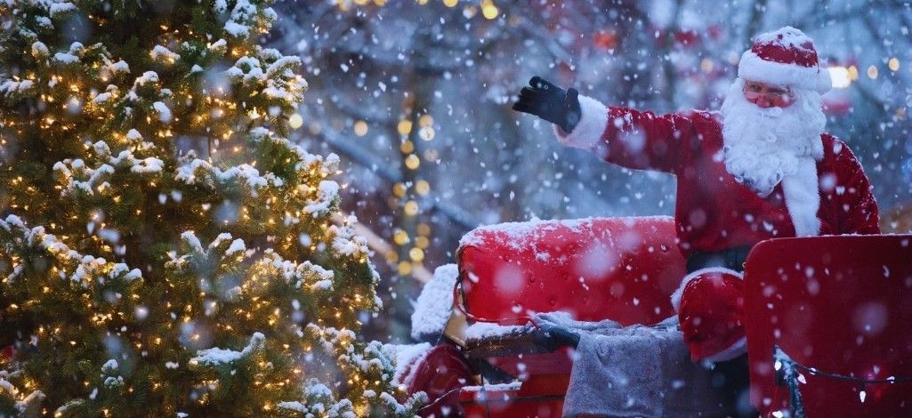 January in Whistler holiday celebration with Santa in falling snow.