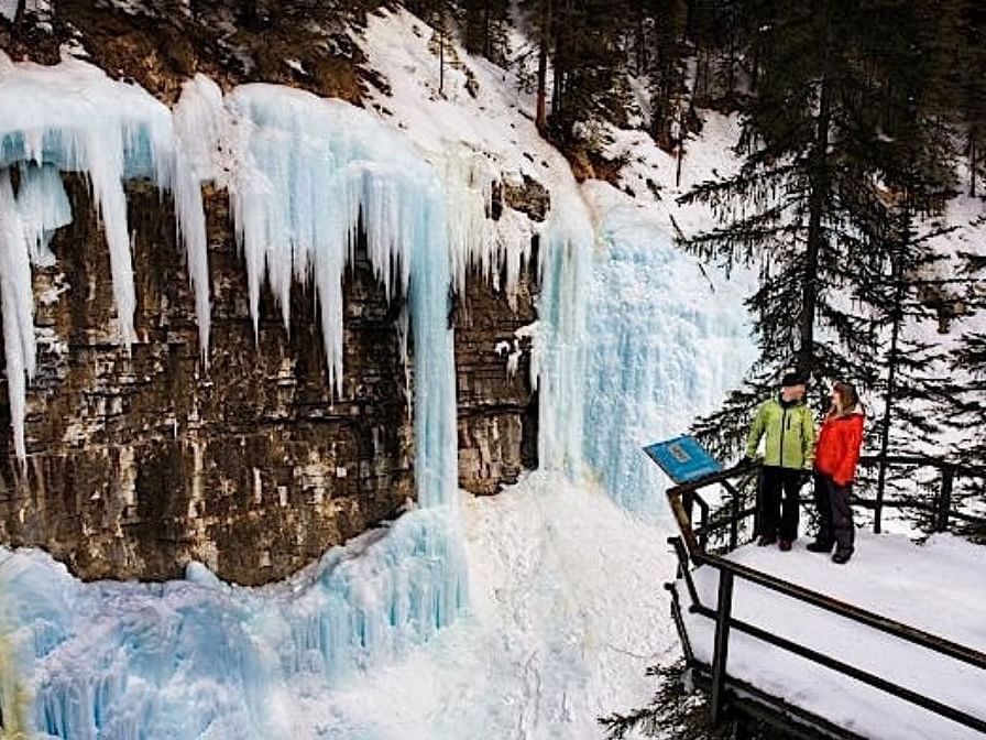 A couple in Johnston Canyon near Clique Hotels & Resorts