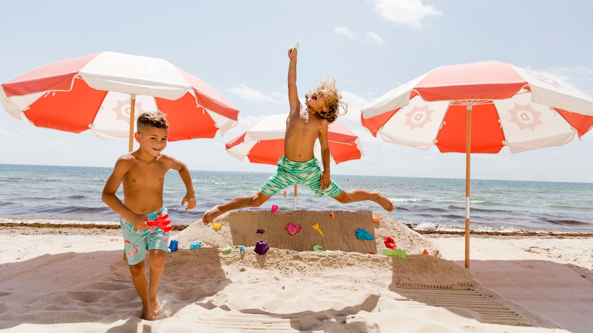 Two boys enjoying in Kid's Beachfront Activity Zone at The Diplomat Resort