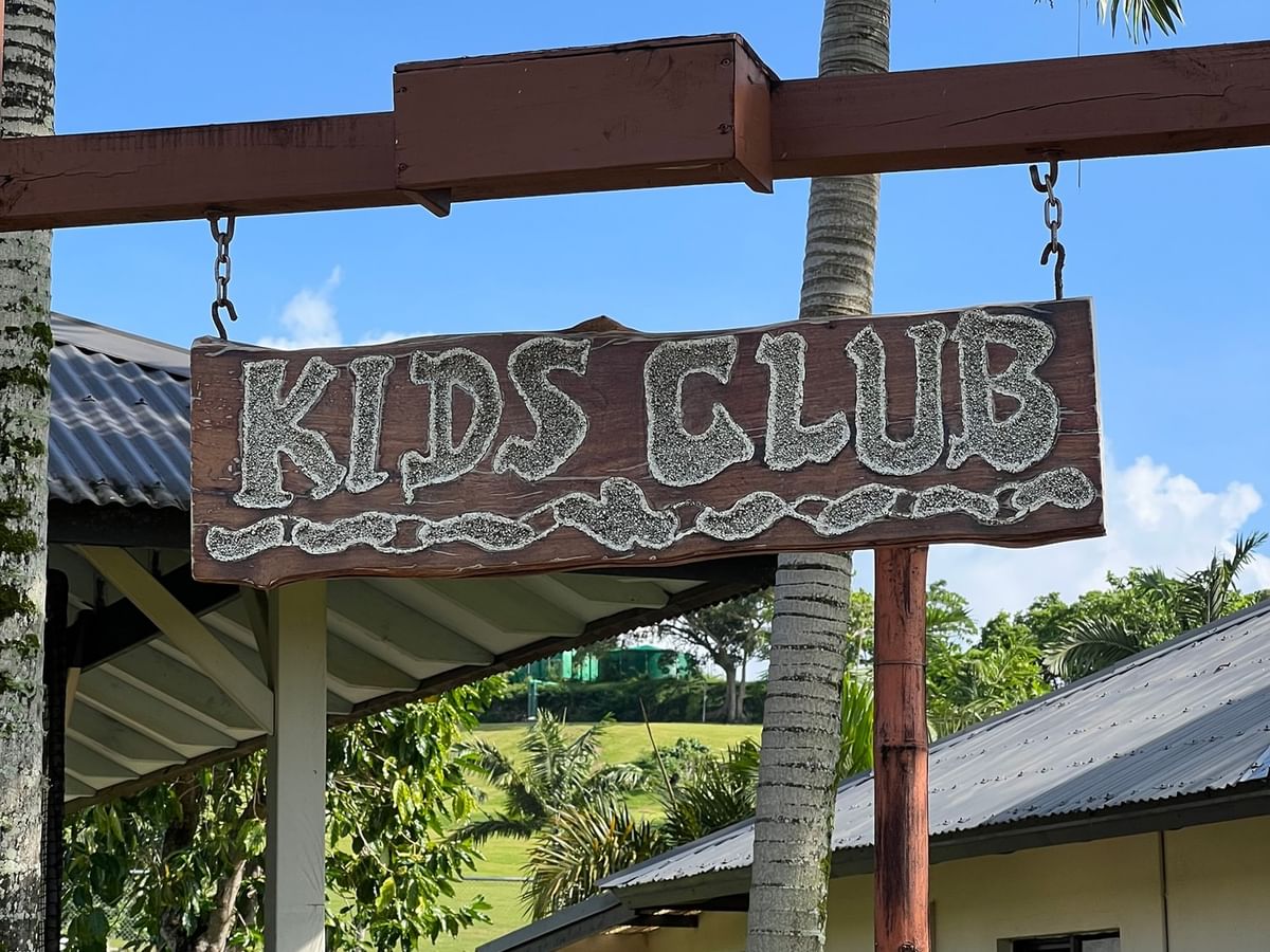 Wooden sign reading Kids Club hanging outside the Funtastik Kids Club at Warwick Le Lagon Vanuatu Efate.