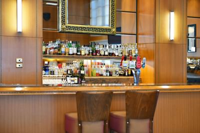 The Bar front displays an extensive assortment of liquor bottles on shelves at Duxton Hotel Perth