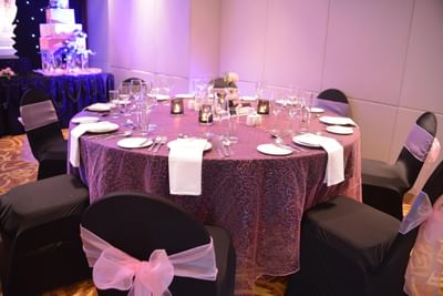 Arranged banquet rounds with cutlery at Eastin Grand Hotel Saigon