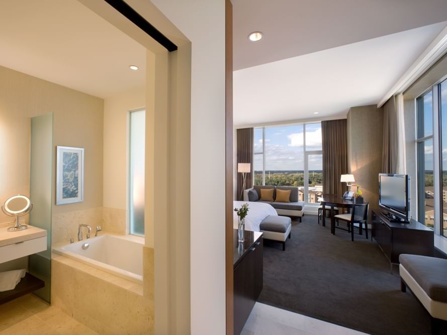 a large bed and couch in a hotel room