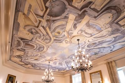 Wall paintings with chandeliers at Castle Hotel and Spa