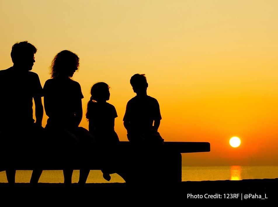 happy family watching sunset together - Grand Lexis PD