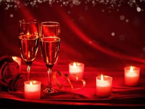 Close up of wine glasses & candles at MCM Elegante Suites