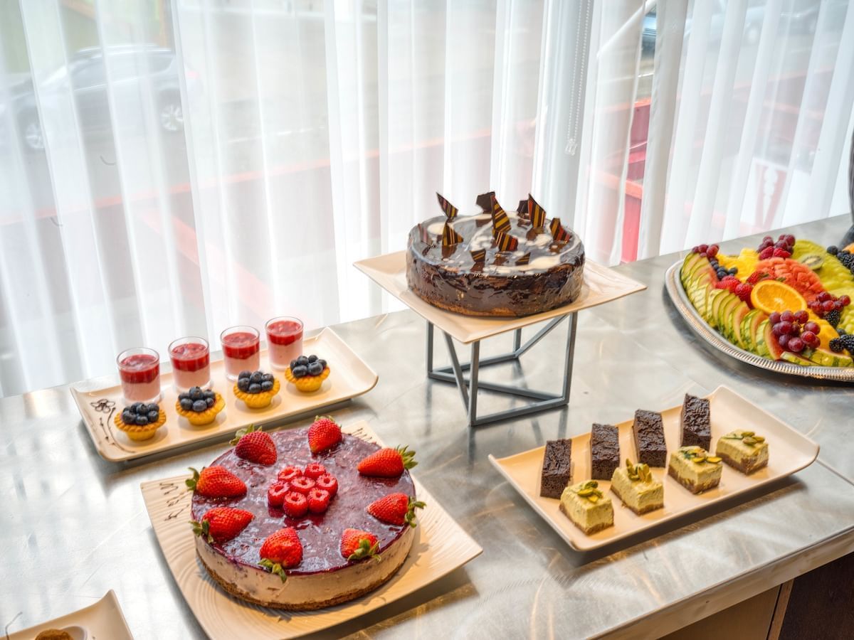 A variety of sweets arranged on a countertop at Matrix Hotel