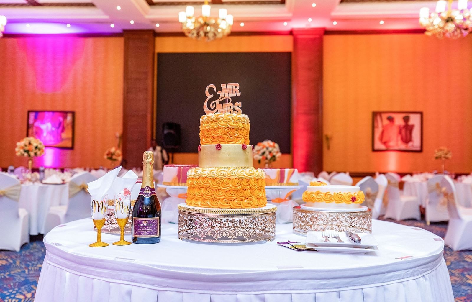 A Wedding cake and champagne on table at Nairobi Serena Hotel
