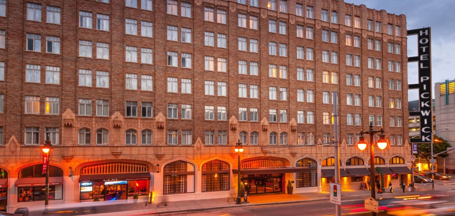 Night view of Pickwick Hotel with blurred cars and street lamps, luxury boutique hotels in San Francisco