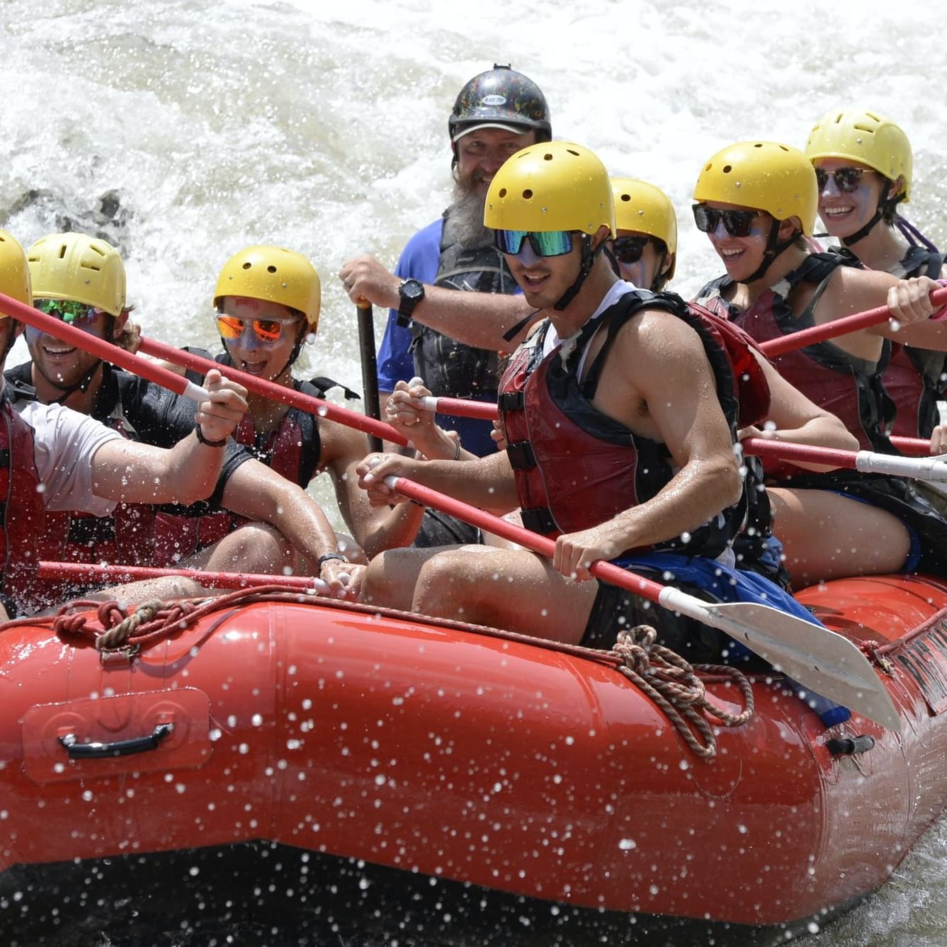 People on a whitewater rafting experience near Hotel Jackson