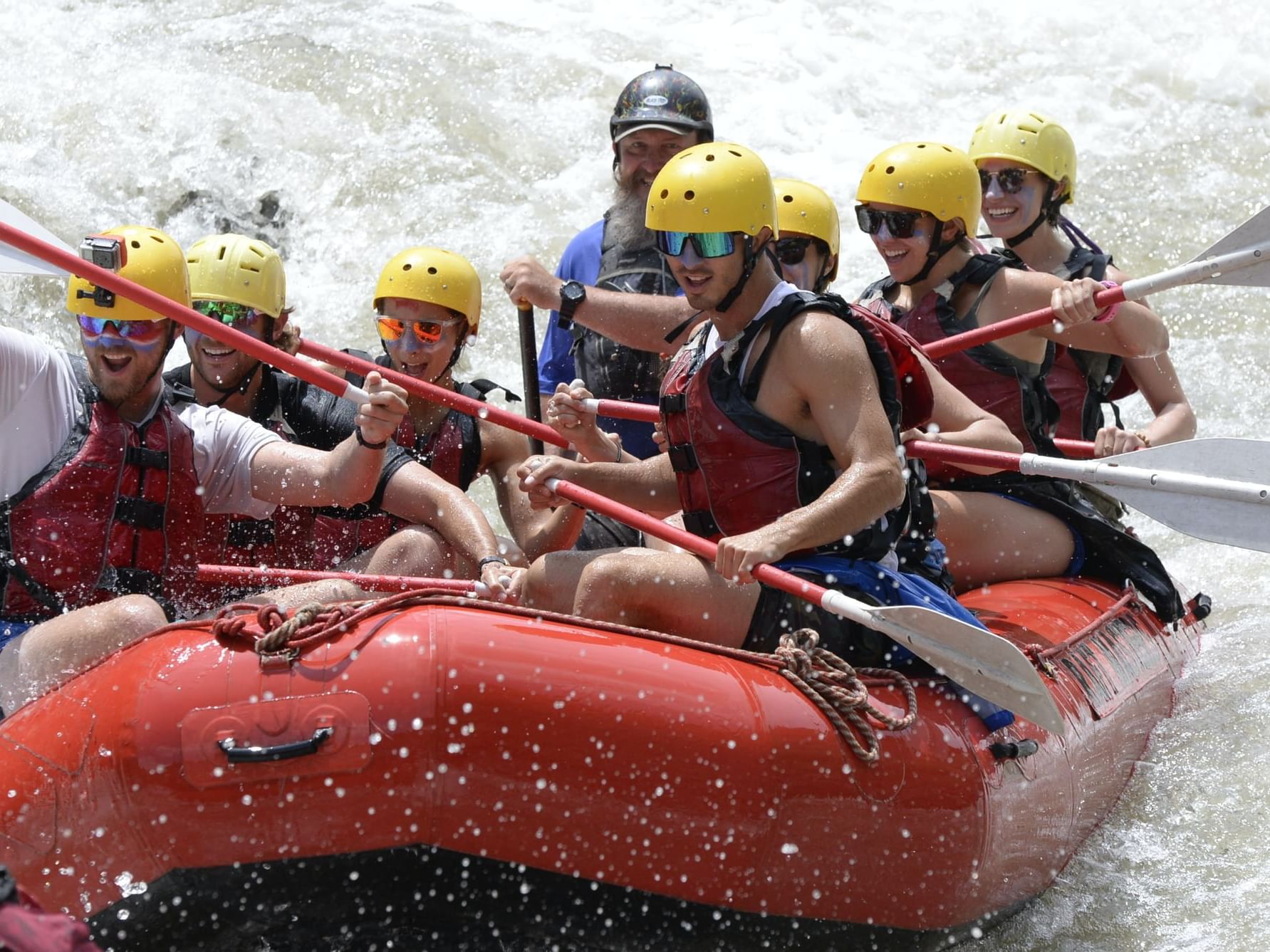 People on a whitewater rafting experience near Hotel Jackson