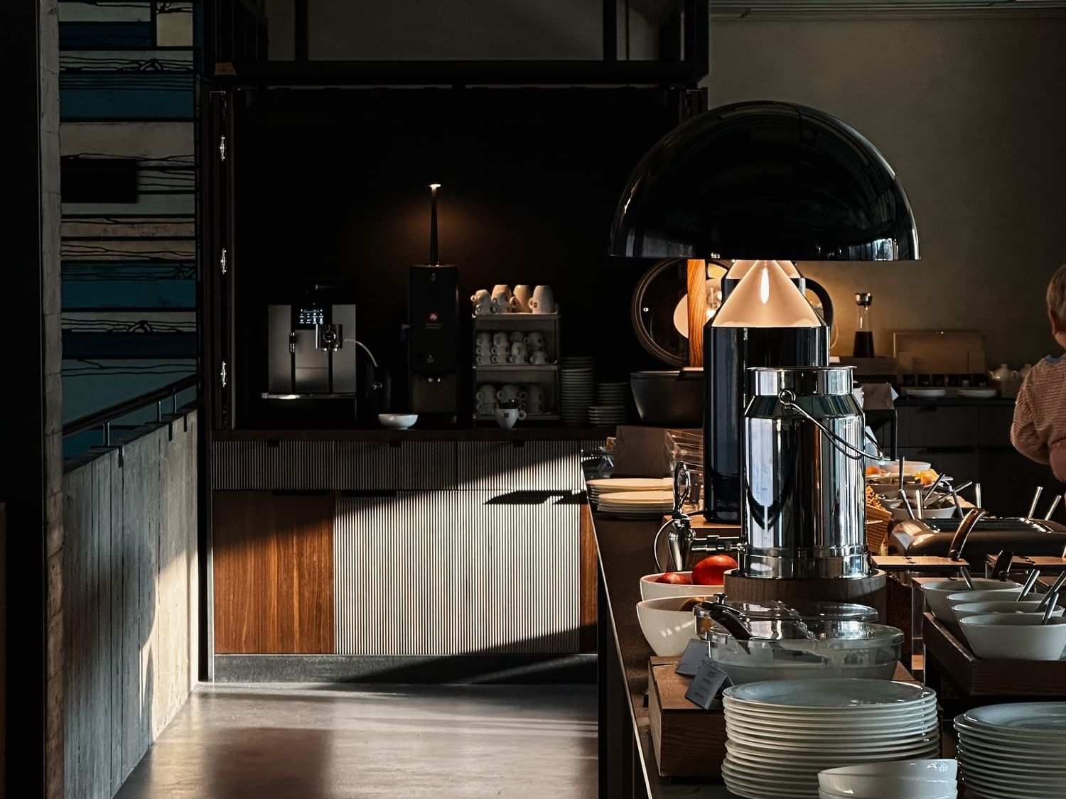 A well-arranged buffet breakfast area with various food options and modern decor at Duparc Contemporary Suites in Torino.