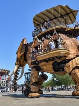 An elephant sculpture with tourists near Oceania Hotels Group