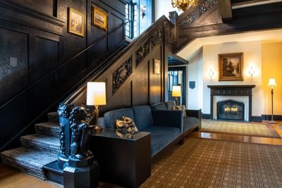 Fireplace & staircase in the lobby area at Castle Hotel and Spa