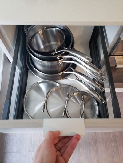 A cabinet with cookware at ReStays Ottawa
