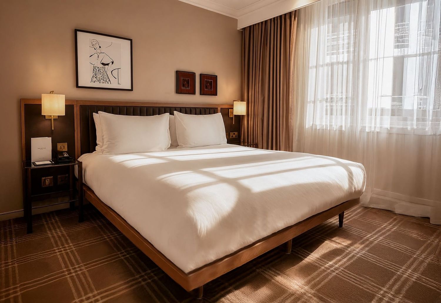 Sunlit Collection Superior Room with king bed, white linens, bedside lamps, and plaid carpet at The May Fair Hotel, London
