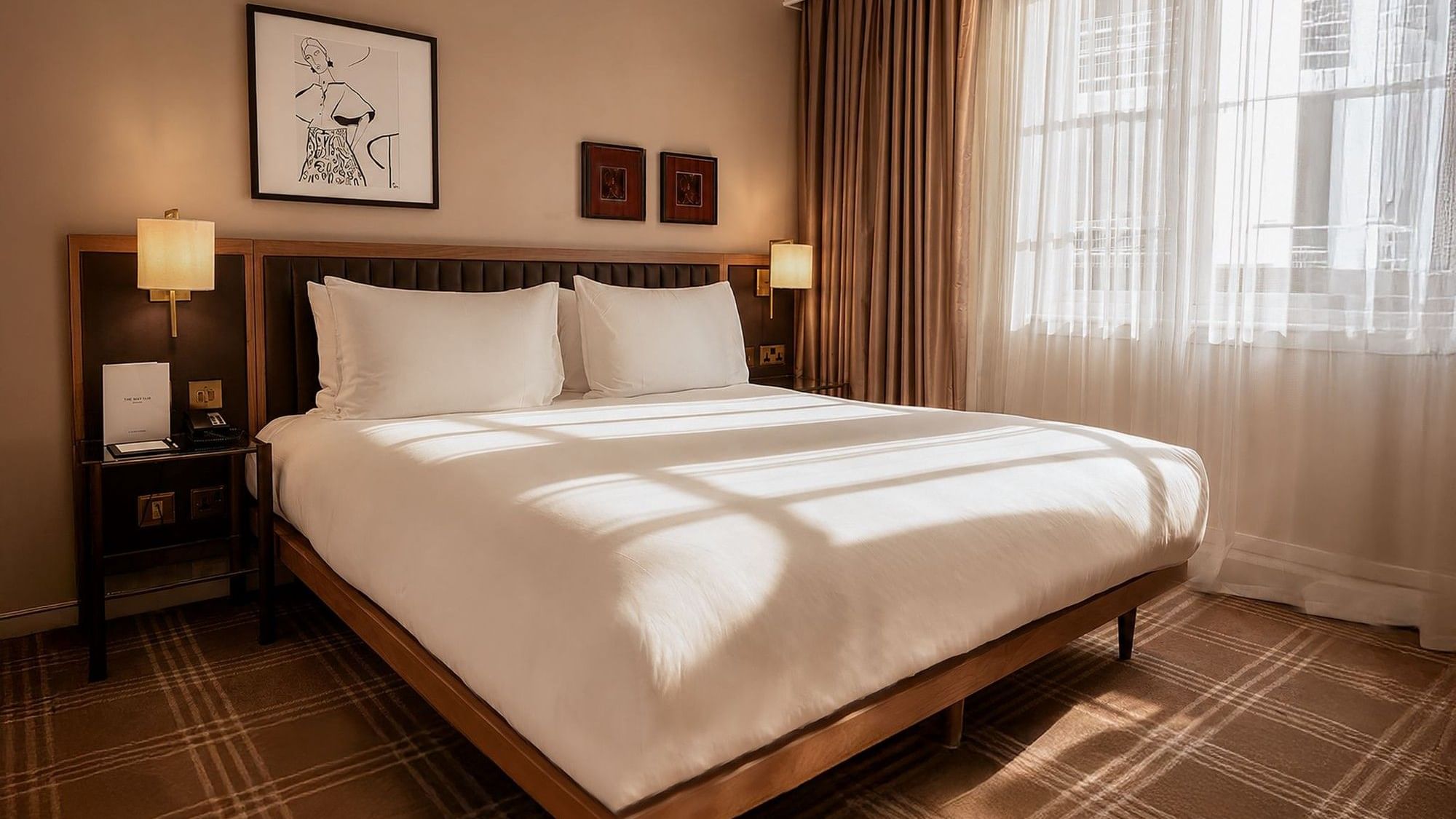 Collection Superior Room with plush bedding, modern furnishings, and natural light at The May Fair Hotel, London.