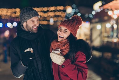 A couple enjoy a romantic winter stroll