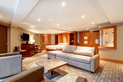 spacious room with furniture and TV at The Inn of Waterloo