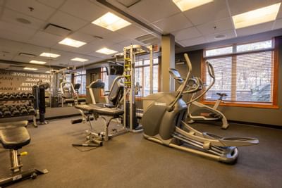 Weights, elliptical, and multi-functional machines in the fitness center at Blackstone Mountain Lodge